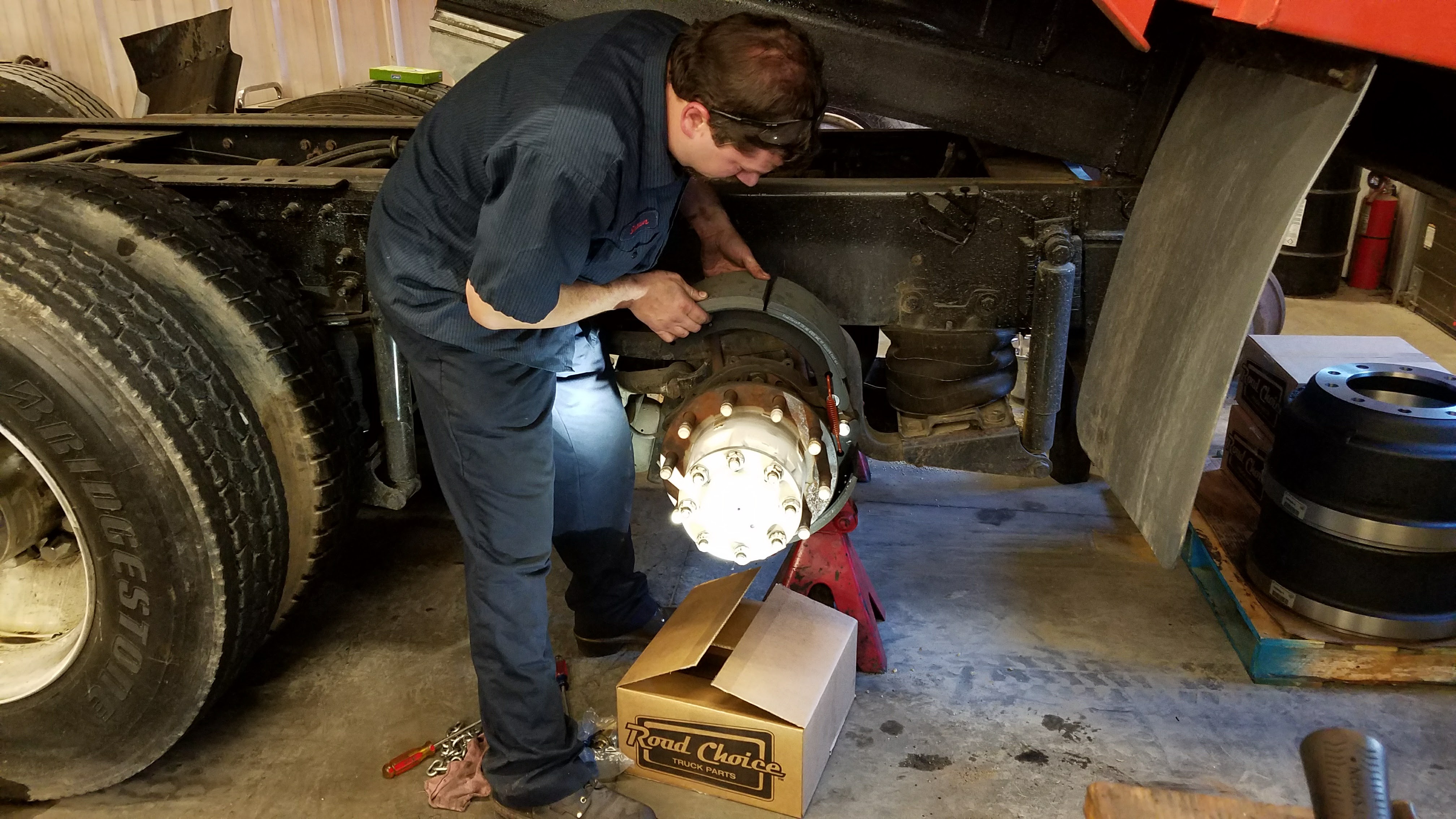 Watt's Truck Center technicians servicing a truck