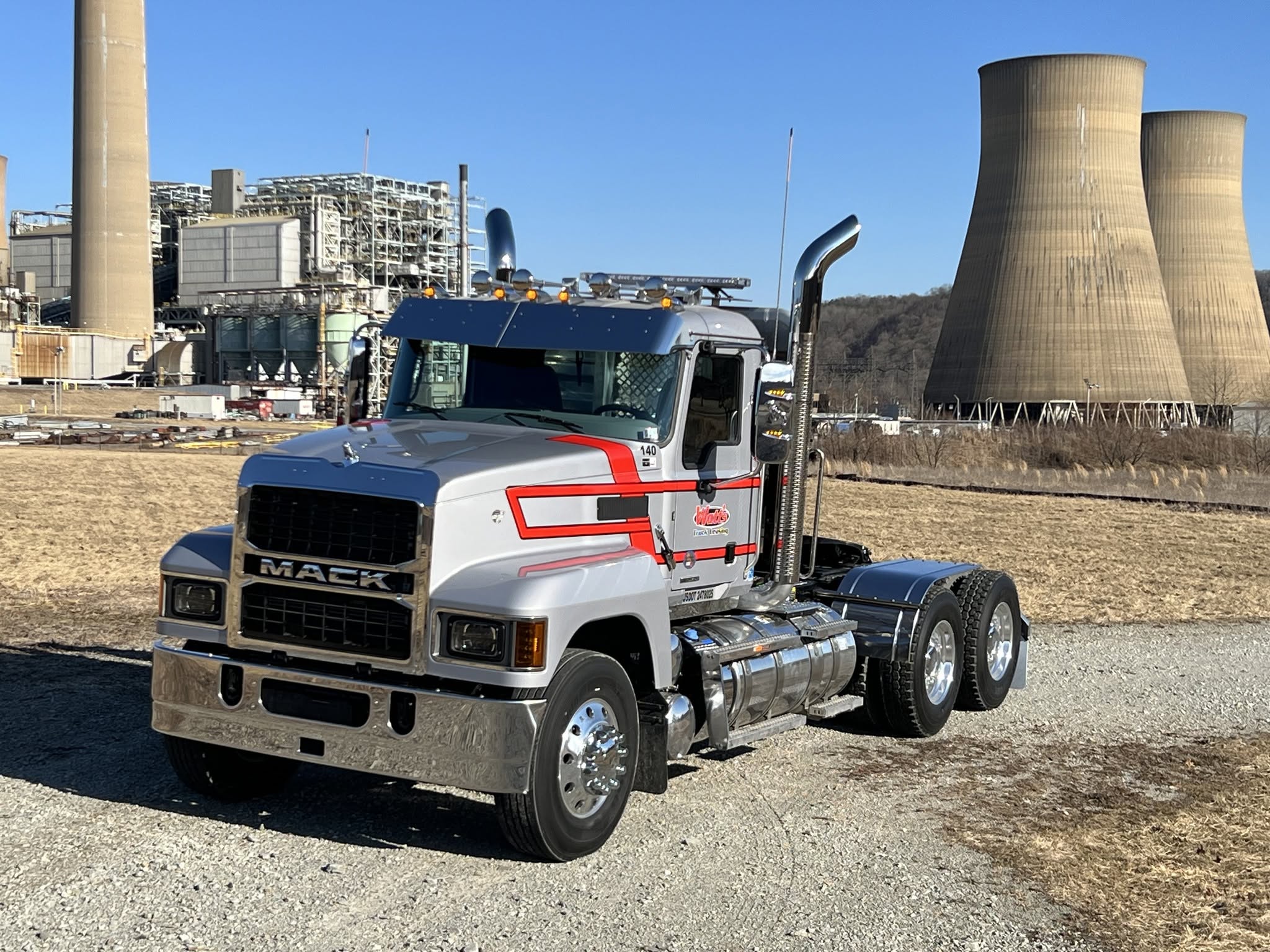 Silver Mack tractor with red accents